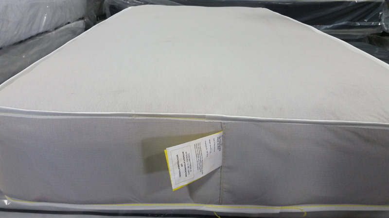 Mattress with federal tag sewn at the foot