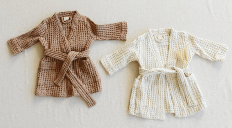 Recalled Goumi children's robes in natural and alabaster color